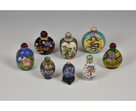 A collection of eight enamel decorated 20th century and earlier Chinese snuff bottles of varying forms, sizes and dates. (8)