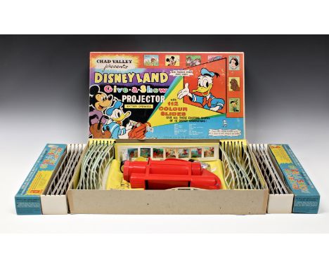 A Chad Valley Disneyland Give-A-Show projector with original 112 colour slides featuring Bambi, Mickey Mouse, Snow White, Don