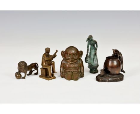 Five bronze figurines comprising a heavy Billiken imp figure, 3¼in. (8.4cm.) high; a Lion with ball; a Spanish lady figure wi