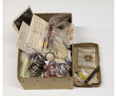 A rummage box of sterling silver and base metal ex-shop stock jewellery accessories to include various silver pendant coin ri