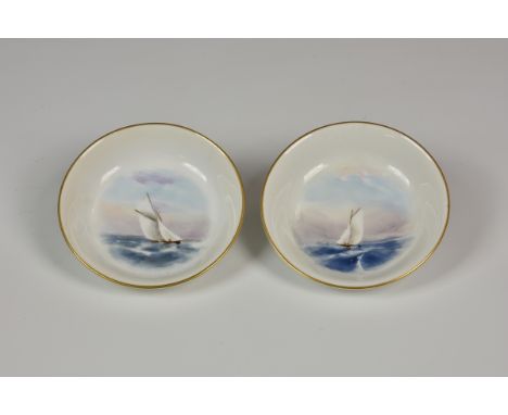 A pair of Royal Worcester porcelain pin dishes painted with yachts in the style of Raymond Rushton, date code for 1909, 3 3/8