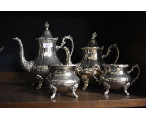 Two Victorian style silver plated footed coffee or tea pots, the largest measures 26cm tall, a cream jug, and sucrier, all ma