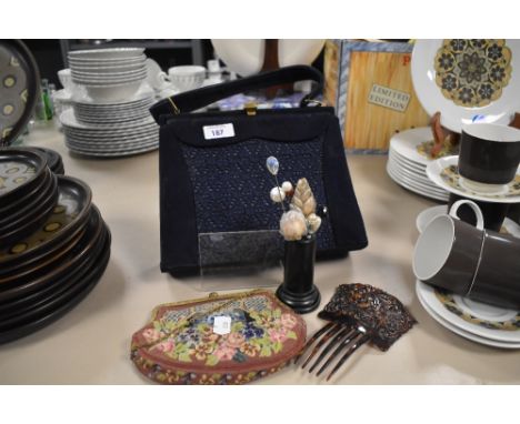 A vintage blue handbag with lace work insert, a tapestry purse with gilt metal clasp, a hair comb in faux tortoise shell and 