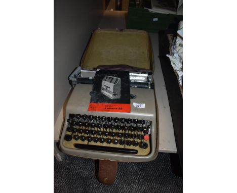 A vintage Olivetti typewriter model lettera 22 in original case.