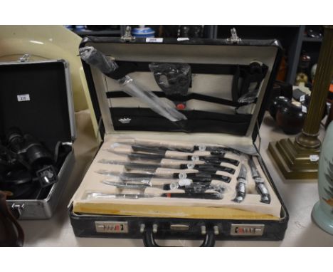 A Kronenberg S.G. unused deluxe knife and kitchen utensil set in two layer fitted case, containing comprehensive set of knife