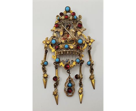 A 19th century continental yellow metal and enamel brooch, pierced and with St.George slaying the dragon to centre, with hing