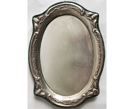 An Edwardian Art Nouveau oval silver photograph frame, by A C Jackson & Co, assayed Birmingham 1907, stamped "Rd.481707", wit