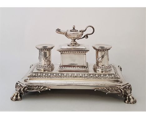 A Victorian silver desk stand, by Edward & John Barnard, assayed London 1863, of canted rectangular form raised upon quadrupl