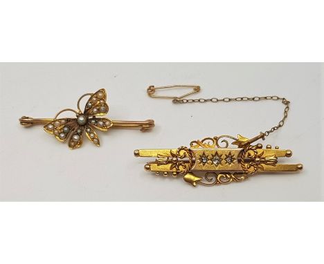 An Edwardian 15ct. gold and diamond set bar brooch, set three graduated old round cut diamonds, assayed Chester 1902, length 