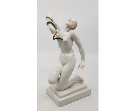 A Herend hand painted porcelain figurine, model no.5722, in the Art Deco style, of Cleopatra kneeling with an asp entwined to