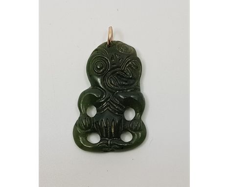 A Maori spinach jade anthropomorphic pendant, pierced and carved, height 37mm. Condition: Good, no chips or fractures, extra 