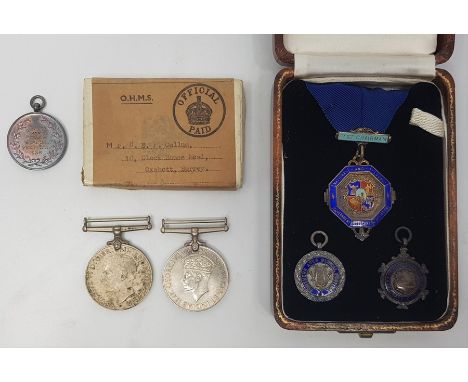A collection of four various silver and silver and enamel medals, together with 1939-1945 Defence and Victory medals. (6)