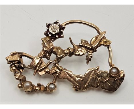 "Desert Sun",&nbsp;a 9ct. gold, diamond, pearl and garnet brooch by Sheana M.Stephen,&nbsp;with original invoice signed by th