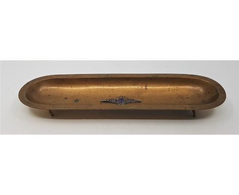 RAF/Fountain pen Interest: An Ortner &amp; Houle brass pen tray, with applied silver and enamel RAF wings badge to well,&nbsp