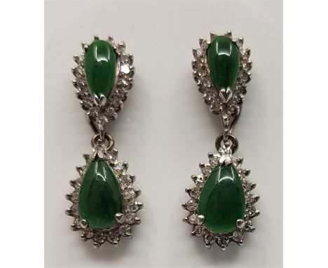 A pair of 9ct. white gold, apple green jade and clear stone set drop earrings, the hinged drop removable if worn as studs. (g