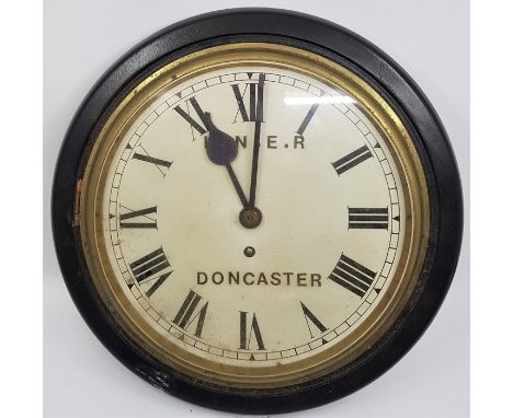 Railway interest: An LNER Doncaster wall clock, 33.5cm wide case, having white enamel Roman numeral dial with outer minutes t