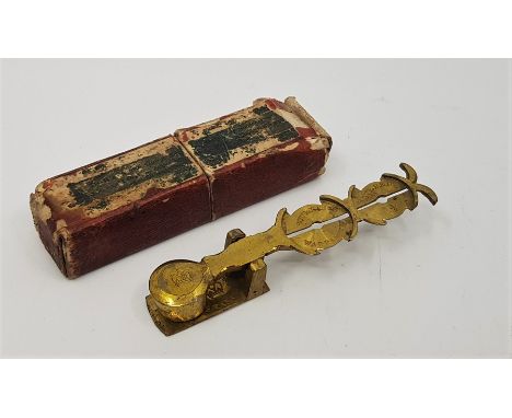 A set of brass sovereign scales, in remains of original card box.