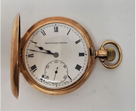 A Bravingtons Renown 9ct. gold half hunter pocket watch, crown wind, having white enamel Roman numeral dial with Arabic numer