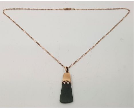 A precious yellow metal and adze head spinach jade pendant, length 38mm, suspended from precious yellow metal Figaro chain, l