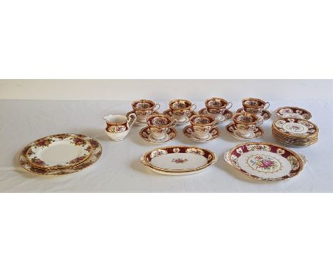 A Royal Albert "Lady Hamilton" part tea service for eight, to include: 7 x tea cups with eight saucers, 8 x 15.9cm cake/sandw