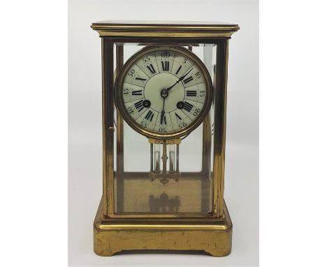A 20th century French gilt brass mantle clock, gong strike, having circular white dial with Roman numeral hours and Arabic nu