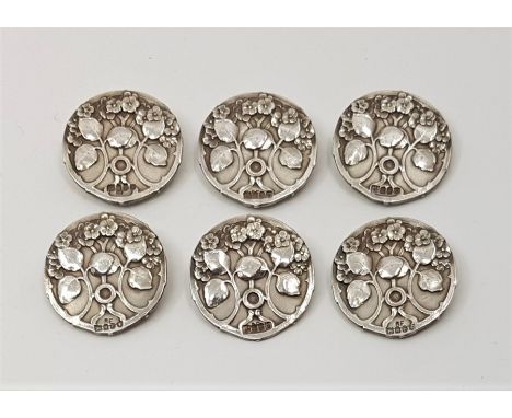A set of six Art Nouveau silver circular buttons, import assayed London 1903, sponsors mark for Robert Friederich, cast and c