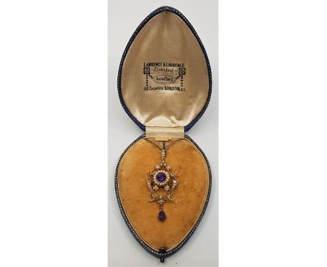 A Belle Epoque 9ct. gold, amethyst and seed pearl set pendant/brooch, of typical openwork form set round cut amethyst to cent