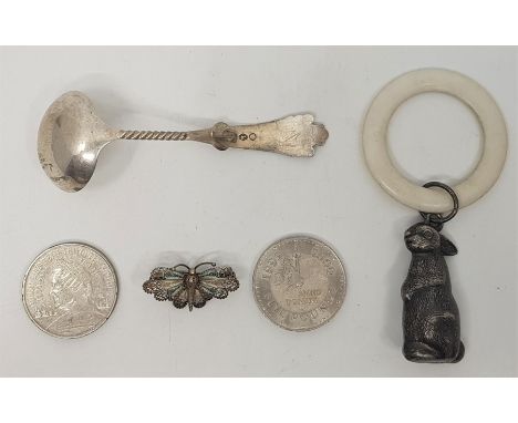 A silver plated babies rattle fashioned as a rabbit, together with a Dutch silver sauce ladle, a continental silver and ename