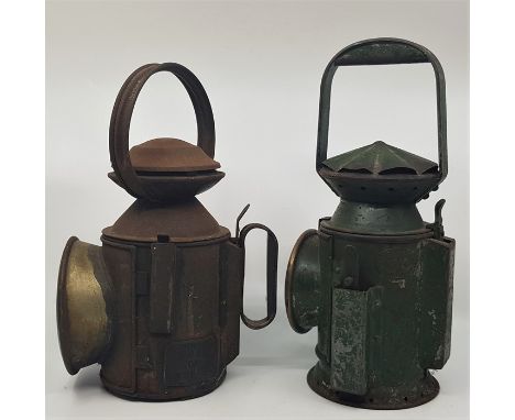Railwayana: A collection of four railway lamps, to include; a green painted lamp with applied plaquette "C. Eastgate & Son Lt