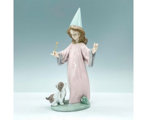 Charming glossy figurine depicting a young person dressed as a wizard with wand trying to command puppy. Lladro backstamp. Ar