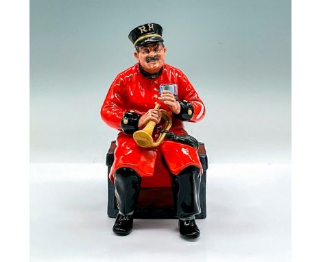 A porcelain figure of an older gentleman in red military jacket and black pants holding a bugle and sitting on a crate. Royal