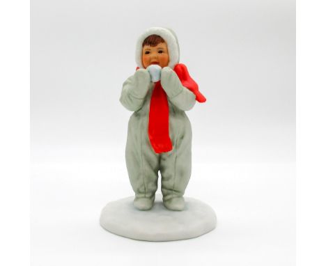 Ceramic figurine modeled as child in gray snowsuit and red scarf making a snowball. Matte finish.Inspired by the art of Donal