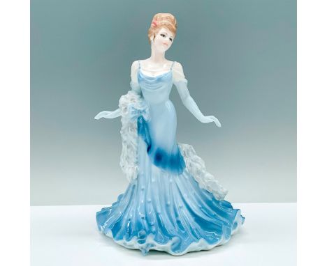 A porcelain figurine of a woman in a lite blue dress with a scarf wrapped around her arm in a mid-spin position. Coalport Fig