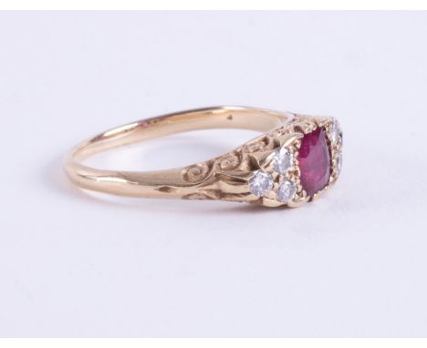 A yellow gold ring (no hallmarks &amp; not tested) with scroll design, set with a central square cut ruby, approx. 0.65 carat