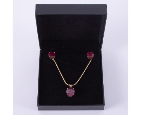 A set comprising of an 18ct yellow gold pendant set with an oval cut ruby, approx. 5.95 carats on an 18ct yellow gold 17" sna