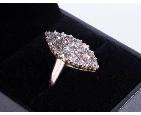 An antique marquise shaped ring in yellow &amp; white gold (not hallmarked or tested) set with old round cut diamonds, approx