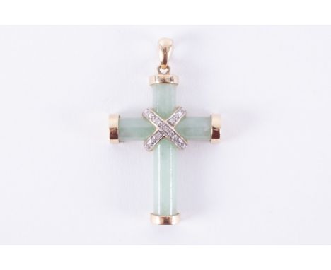 A 9ct yellow gold jade cross with a white gold central crossover design set round cut diamonds in an illusion setting, approx