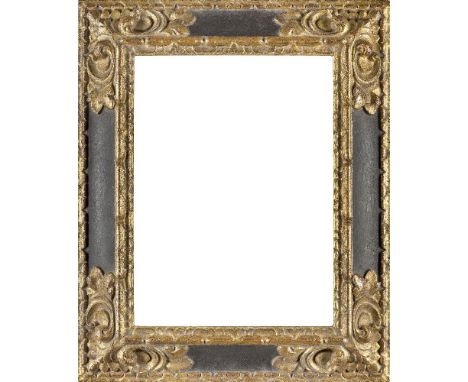 A Carved Parcel Gilded and Ebonised Spanish Style Frame, late 20th century, ( VAT charged on hammer price)with leaf ogee sigh