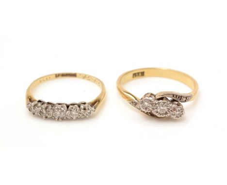 A three stone diamond ring, the 18ct yellow gold shank stamped '18ct'; and a five stone diamond ring, the in platinum mount a