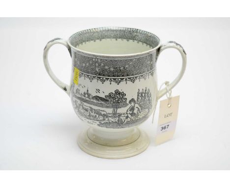 A 19th Century ceramic twin-handled loving cup, decorated with landscape scenes and inscribed 'Christopher North', raised on 
