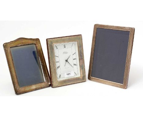 A silver mounted table clock, by R. Carr; together with two silver mounted picture frames. 