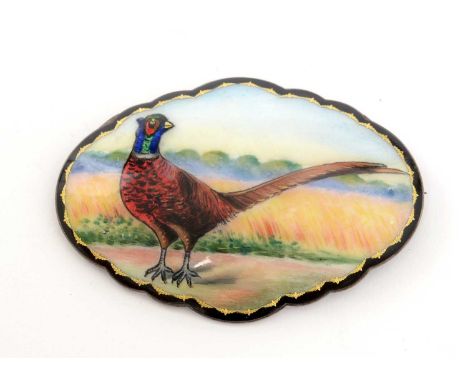 A Continental silver and enamel brooch, by N.M, of shaped oval form decorated with a pheasant, 7.2cms wide. 