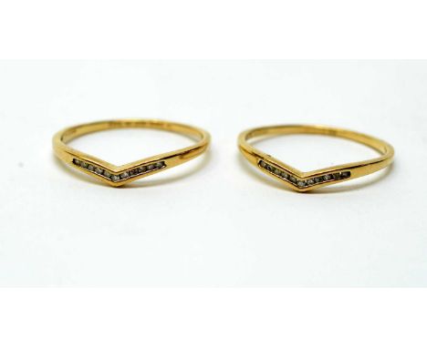 Two diamond set wishbone pattern rings, inscribed with marital vows to 9ct yellow gold shank, ring size U, 3.0g gross