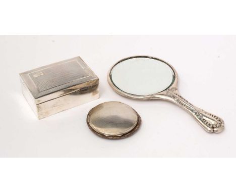 A silver mounted cigarette box; a silver mounted hand mirror, with rose and ribbon design; and a silver compact, with engine 