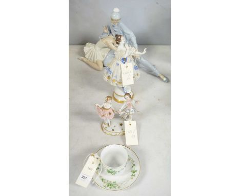 A Lladro figure group of a ballerina and a male dancer; together with a figure of a lady; a figure group of a dancing couple;