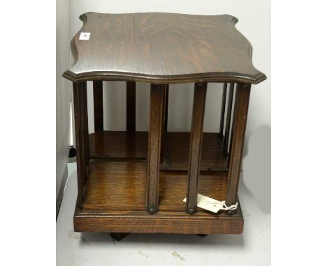 An early 20th Century stained oak table-top revolving bookcase by Globe Wernicke &amp; Co, of square form, 33cms wide x 32cms