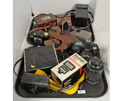 A selection of vintage cameras and accessories, including: a Nikon F70; a Kodak Instamatic 233-X camera; a Sankyo cine camera