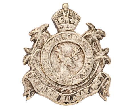 Indian Army. Nilgiri Malabar Battalion AFI post 1917 cap badge.  Good scarce crudely cast white metal crowned strap AUXILIARY