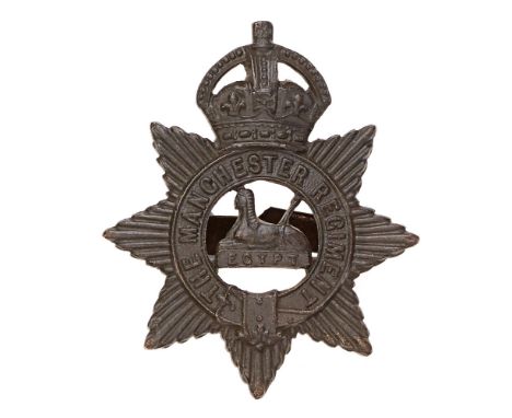 Manchester Regiment OSD field service cap badge.  Good scarce die-cast crowned star bearing tile strap; Sphinx on EGYPT to vo