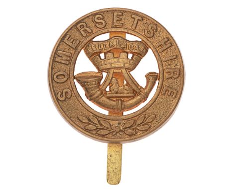 Somerset Light Infantry post 1881 pagri badge.  Good die-stamped brass SOMERSETSHIRE circlet with laurel sprays; to the voide
